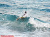 Aaron bunch taking a bait out with a surfboard during the 2009 Blacktip Challenge shark fishing tournament in Florida